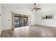 Cozy living room with sliding glass doors leading to a screened-in porch overlooking the water at 37734 N County Road 44A, Eustis, FL 32736