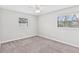 Neutral bedroom featuring soft carpet, a ceiling fan and plenty of natural light at 402 Firewood Ave, Eustis, FL 32726