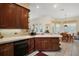 Charming kitchen featuring dark wood cabinets and a breakfast nook with natural light at 5029 Greenbriar Trl, Mount Dora, FL 32757