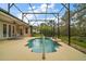 Enjoy the backyard pool, surrounded by a screened enclosure and comfortable seating area at 5029 Greenbriar Trl, Mount Dora, FL 32757