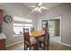 Sunny breakfast nook with sliding door to the lanai, and neutral walls at 509 Grand Vista Trl, Leesburg, FL 34748