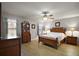 Main bedroom features neutral paint, ceiling fan, and lots of closet space at 509 Grand Vista Trl, Leesburg, FL 34748