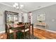 Elegant dining room featuring hardwood floors, a stylish chandelier, and tasteful decor at 5262 Royce Dr, Mount Dora, FL 32757