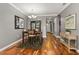 Elegant dining room featuring hardwood floors, a stylish chandelier, and tasteful decor at 5262 Royce Dr, Mount Dora, FL 32757