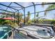 Hot tub with jets and tropical landscaping visible from the pool at 5262 Royce Dr, Mount Dora, FL 32757