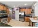 Spacious kitchen featuring stainless steel appliances, granite countertops, and ample cabinet space at 5262 Royce Dr, Mount Dora, FL 32757