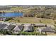 Aerial view of house with pool and surrounding greenery at 569 Bellflower Way, Clermont, FL 34715