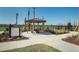 The Canyons dog park, featuring a shaded gazebo and ample space for furry friends at 569 Bellflower Way, Clermont, FL 34715