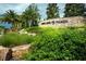 Beautiful Highland Ranch entrance with lush greenery and stone signage, creating a welcoming first impression at 569 Bellflower Way, Clermont, FL 34715