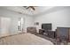 Bedroom with an ensuite bathroom and a ceiling fan at 569 Bellflower Way, Clermont, FL 34715