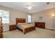 Spacious bedroom with carpet, ceiling fan, and plentiful natural light at 5824 Blue Savannah Dr, Leesburg, FL 34748