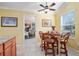 Cozy breakfast nook with barstool seating, tile floors, and plenty of natural light at 592 Netherwood Pl, The Villages, FL 32163