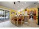 Eat-in kitchen with dining table, tile floors, and sliding doors to the exterior at 592 Netherwood Pl, The Villages, FL 32163