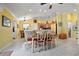 Charming dining area adjacent to kitchen, featuring tile floors and decorative accents at 592 Netherwood Pl, The Villages, FL 32163