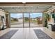 Clean, open garage with epoxy floors and a view of the neighborhood through the open door at 592 Netherwood Pl, The Villages, FL 32163