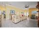 Inviting living room showcasing tile floors, recessed lighting, and tasteful decor at 592 Netherwood Pl, The Villages, FL 32163