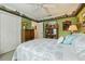 Bedroom featuring golf themed decor, a ceiling fan, and ample closet space at 610 Espana St, The Villages, FL 32159