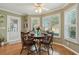 Inviting breakfast nook with shuttered windows, creating a warm and comfortable dining space at 610 Espana St, The Villages, FL 32159