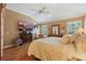 Main bedroom featuring tray ceilings and plenty of natural light at 610 Espana St, Lady Lake, FL 32159