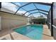 A refreshing screened in pool with clear water, offering a relaxing outdoor experience at 610 Espana St, The Villages, FL 32159