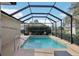 Private in-ground pool with screened enclosure and a sun-drenched patio, perfect for relaxation at 610 Espana St, Lady Lake, FL 32159