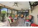 Spacious sunroom featuring a sofa and several chairs, perfect for relaxing at 610 Espana St, The Villages, FL 32159