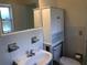 Bright bathroom featuring a white sink and toilet at 616 N Hartley Cir, Deltona, FL 32725