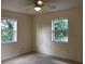 Bedroom with two windows at 616 N Hartley Cir, Deltona, FL 32725