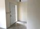 Clean entryway with a white door, neutral walls, and durable flooring at 616 N Hartley Cir, Deltona, FL 32725