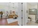 Bright bathroom featuring a glass shower and vanity with artwork on the walls at 6801 Silver Charm Ct, Leesburg, FL 34748