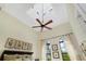 Bright bedroom with tall ceilings, enhanced by a ceiling fan, creating a comfortable and airy living space at 6801 Silver Charm Ct, Leesburg, FL 34748