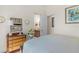 Inviting bedroom featuring a classic wooden dresser, complemented by stylish decor and soft, neutral tones at 6801 Silver Charm Ct, Leesburg, FL 34748