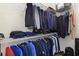 Well-organized closet space, ideal for efficiently storing clothes and accessories, keeping the room clutter-free and tidy at 6801 Silver Charm Ct, Leesburg, FL 34748