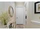 Bright hallway with decor and leading to the laundry room at 6801 Silver Charm Ct, Leesburg, FL 34748