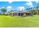 Inviting screened-in pool area offers a perfect blend of relaxation and recreation surrounded by well-maintained lawn at 6801 Silver Charm Ct, Leesburg, FL 34748