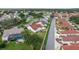 Bird's eye view revealing the home's neat landscaping and proximity to a neighboring community at 723 Palma Dr, Lady Lake, FL 32159