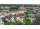 Aerial view showcasing the home's brick driveway, well-manicured lawn, and inviting exterior at 723 Palma Dr, Lady Lake, FL 32159