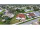 Aerial view showcasing the community, its lush foliage, and homes situated on beautifully manicured lawns at 723 Palma Dr, Lady Lake, FL 32159