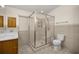 Bathroom featuring a tiled glass-enclosed shower and comfort height toilet at 723 Palma Dr, Lady Lake, FL 32159