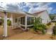 Exterior view of home featuring carport, lush landscaping and a fenced-in yard at 723 Palma Dr, Lady Lake, FL 32159