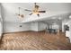 Spacious living room featuring hardwood floors and vaulted ceilings with fans at 723 Palma Dr, Lady Lake, FL 32159