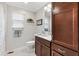 Cozy bathroom features a spacious vanity, toilet, and decor at 879 Pisano Way, The Villages, FL 32163