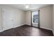 Cozy bedroom with a ceiling fan, hardwood floors, and a window at 902 Chestnut Dr, Fruitland Park, FL 34731