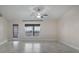 Bright, airy living room with a large window and access to the patio at 902 Chestnut Dr, Fruitland Park, FL 34731