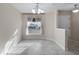 Clean, bright, and airy living room, featuring light-colored walls and flooring with a large window at 902 Chestnut Dr, Fruitland Park, FL 34731