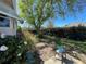 Home's backyard features a lawn, foliage, and shade at 1004 Matthew Ave, Lady Lake, FL 32159