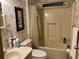 Bathroom featuring wallpaper, toilet, and a tub-shower combo at 1004 Matthew Ave, Lady Lake, FL 32159