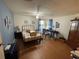Bedroom with laminate flooring, ceiling fan, and desk area at 1004 Matthew Ave, Lady Lake, FL 32159