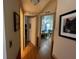 Hallway featuring wood floors and access to living area and bedrooms at 1004 Matthew Ave, Lady Lake, FL 32159