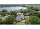 Aerial view of the home near a lake, showing the beautiful surroundings and neighborhood at 1013 Lake Elsie Dr, Tavares, FL 32778